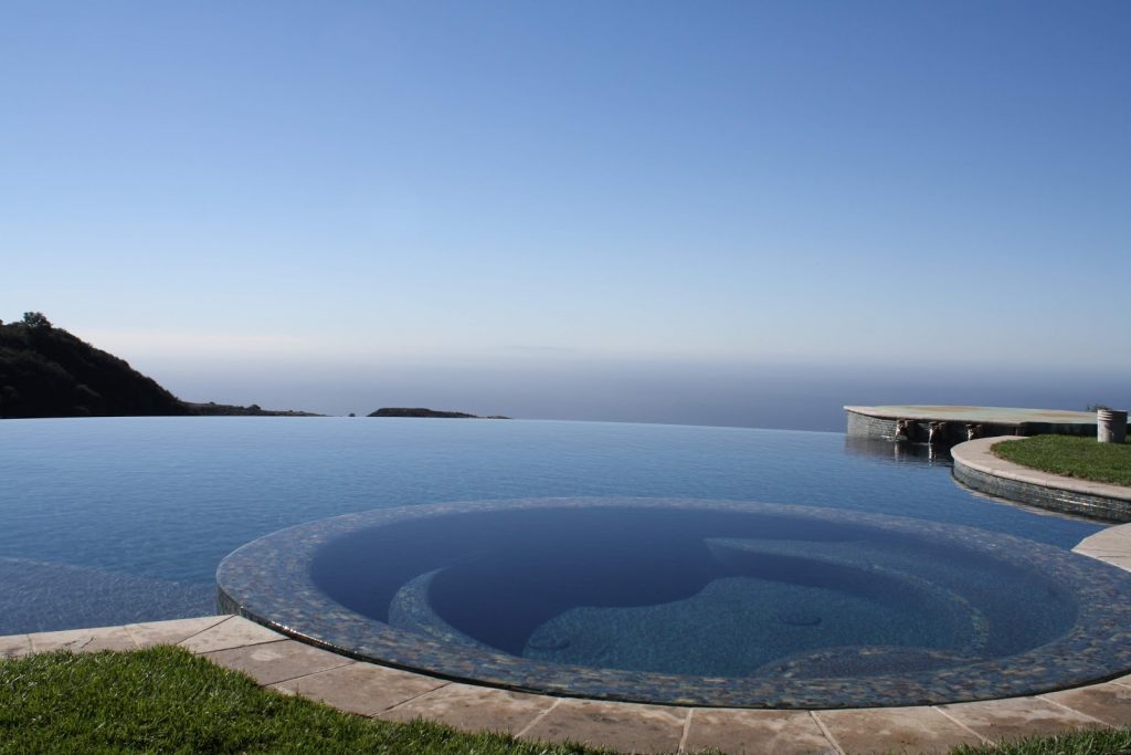 Vanishing edge pool with a view of the surrounding landscape