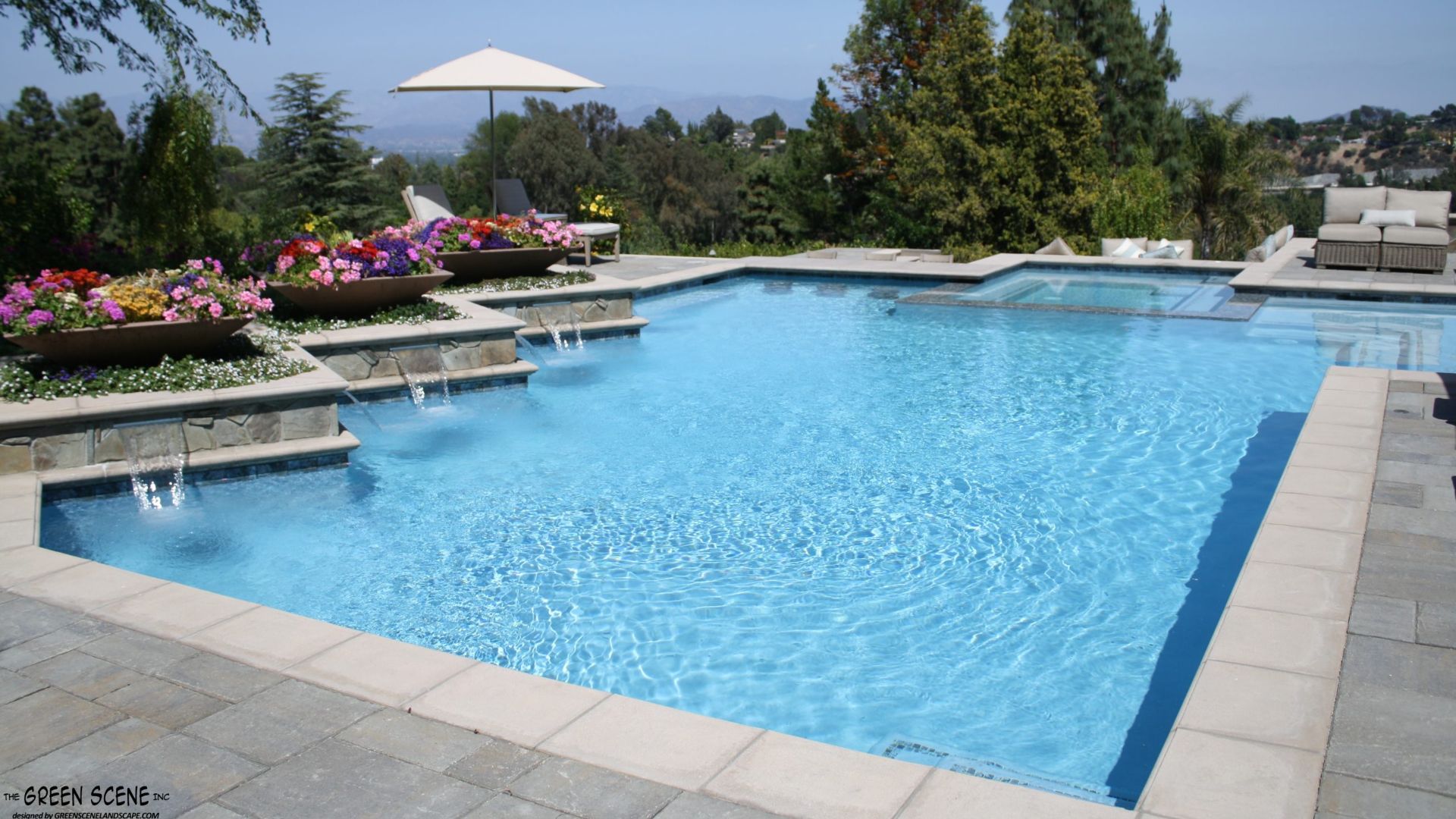 Build a pool in California with water features and landscaping