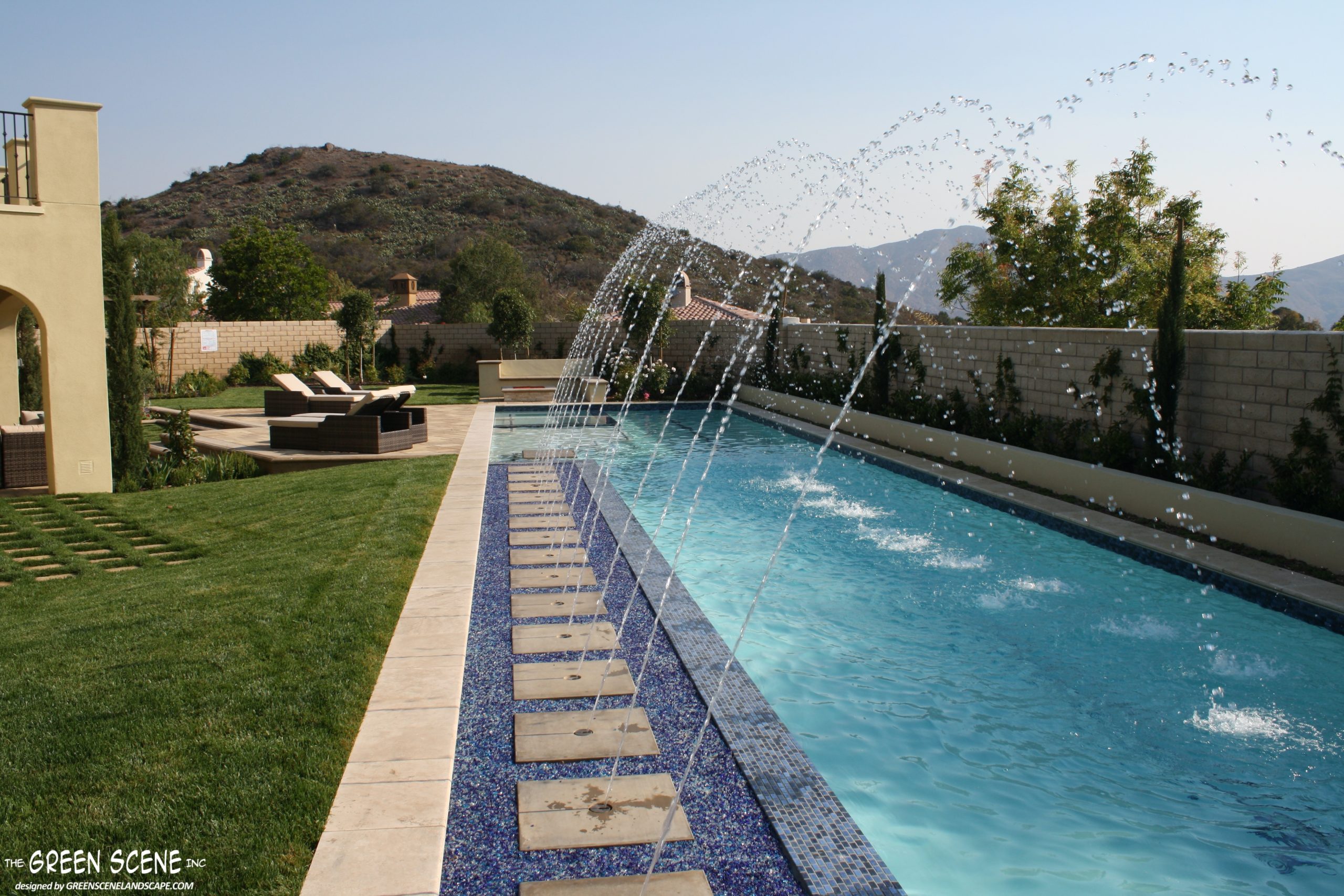 contemporary pool with water features